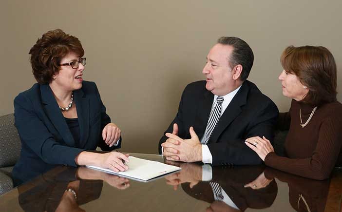 photo of attorney with clients